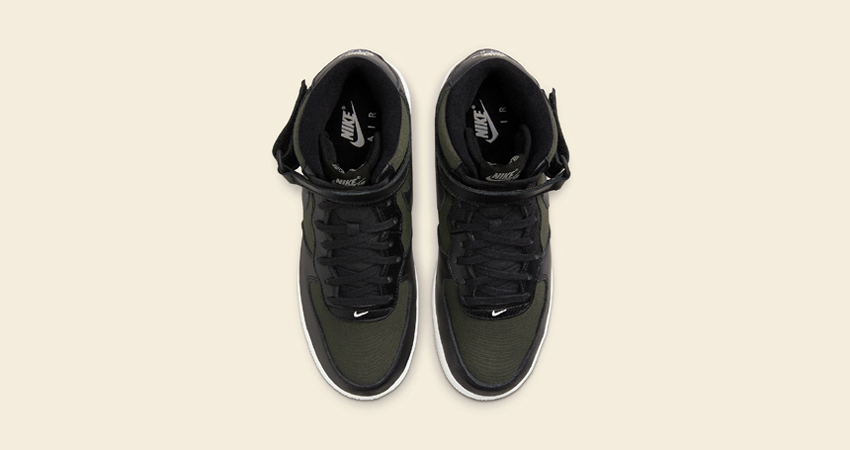 The Nike Air Force 1 Mid Adorns Olive Treated Canvas up